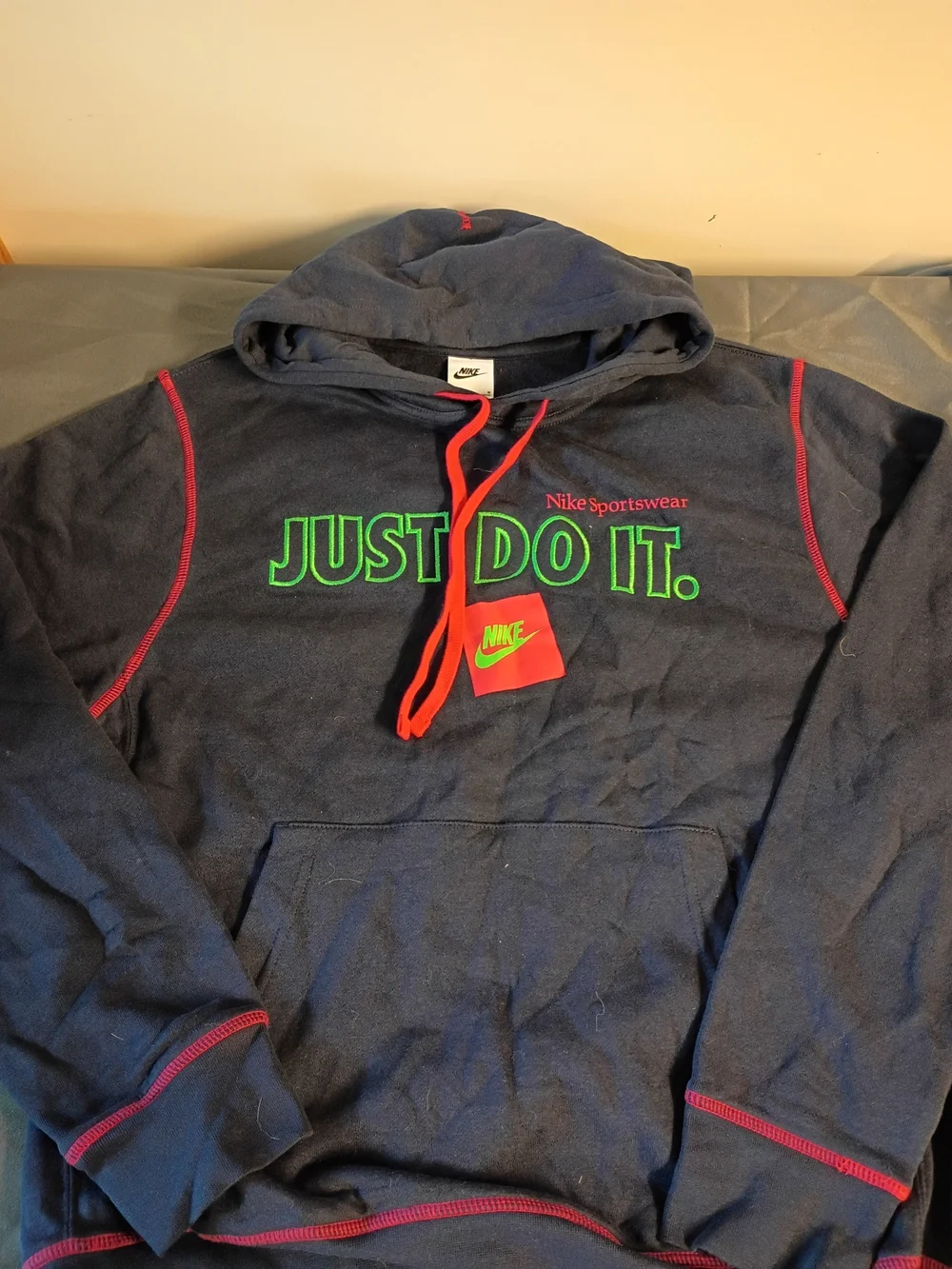 Nike Women's Navy Hoodie with Neon Green 'JUST DO IT.' and Red Accents